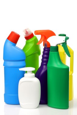 Plastic cleaning bottles in various colors clipart