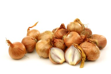Bunch of fresh shallots and a cut one clipart