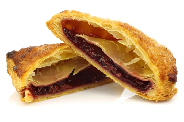 Two halves of traditional dutch filled pastry with cherry jam — Stock Photo, Image