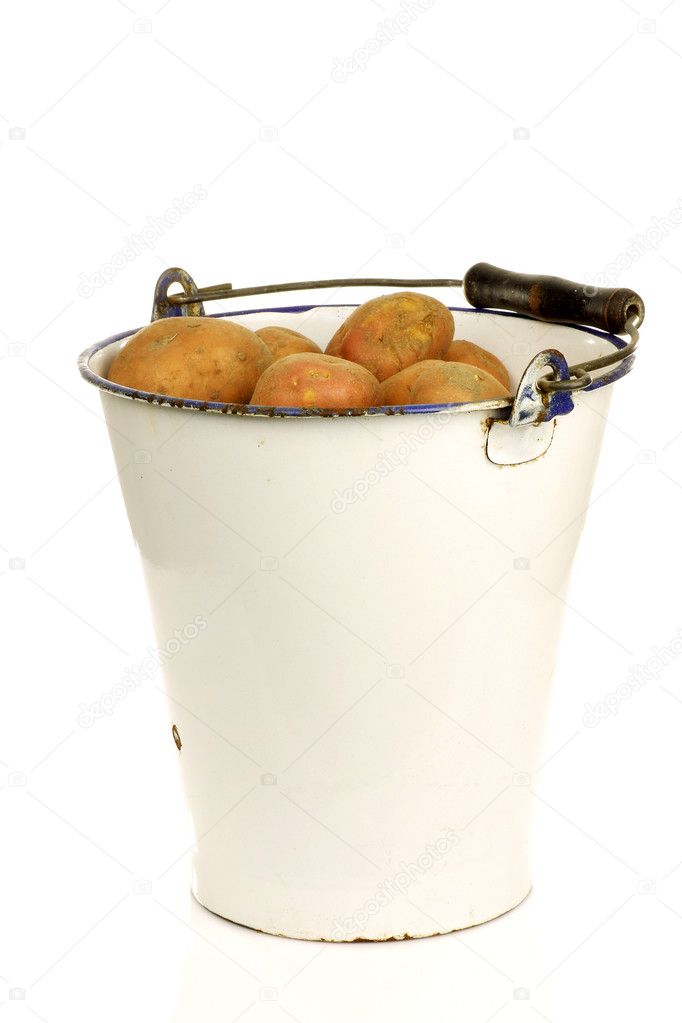 Bunch of potatoes in an old enamel bucket