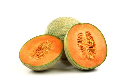 One whole cantaloupe melon and two halves clipart