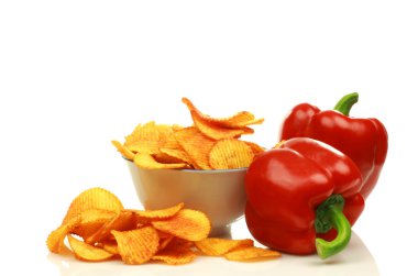 Two red bell peppers and paprika chips clipart