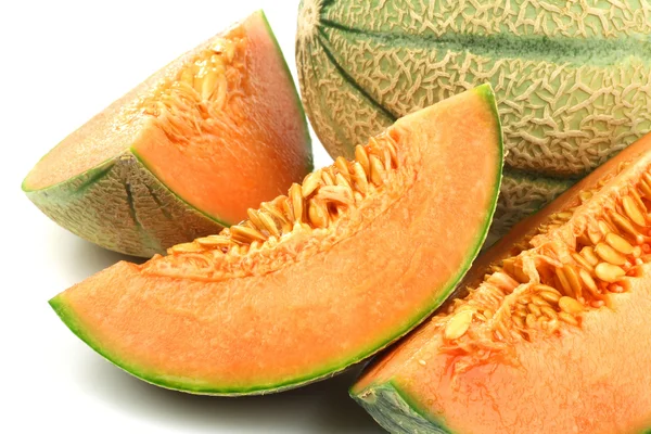 One whole cantaloupe melon and some pieces — Stock Photo, Image