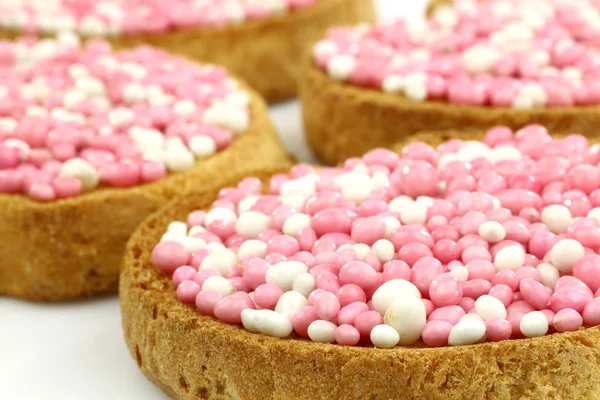 Stock image Rusks with white and pink anise seed sprinkles