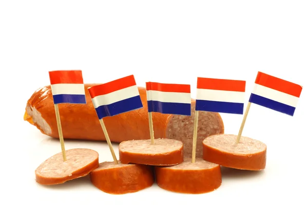 Pieces of cut smoked sausage with Dutch flag toothpicks — Stock Photo, Image