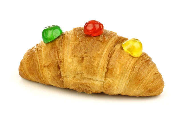 Freshly baked croissant bread with colorful conserved fruits — Stock Photo, Image