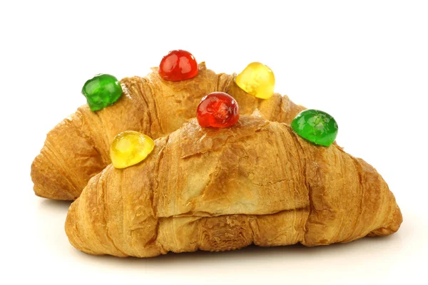 Freshly baked croissants bread with colorful conserved fruits — Stock Photo, Image