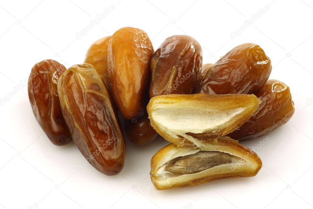 Bunch of dried dates and an opened one