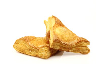 Two freshly baked crispy apple turnovers clipart