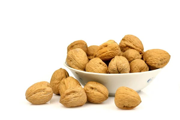 Bowl with a bunch of walnuts — Stock Photo, Image