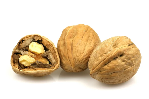 Bunch of walnuts with one cracked walnut — Stock Photo, Image