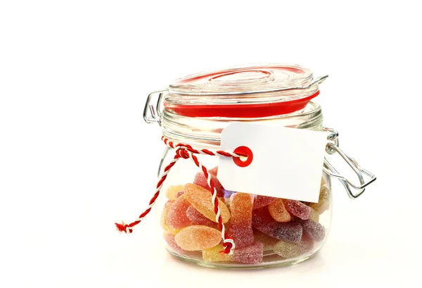 Tarro de vidrio con caramelos de colores con espacio para su texto — Foto de Stock