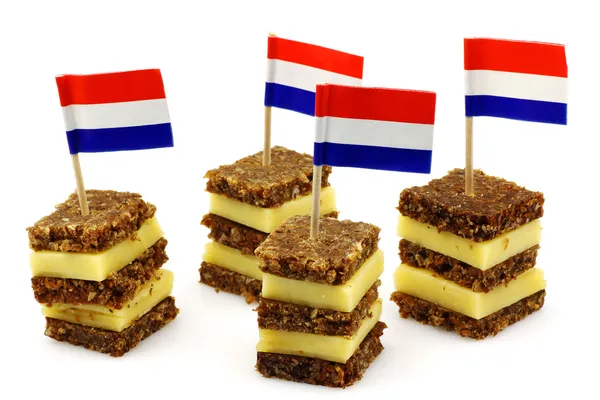 Layered rye bread and cheese snacks with Dutch flag toothpick — Stock Photo, Image