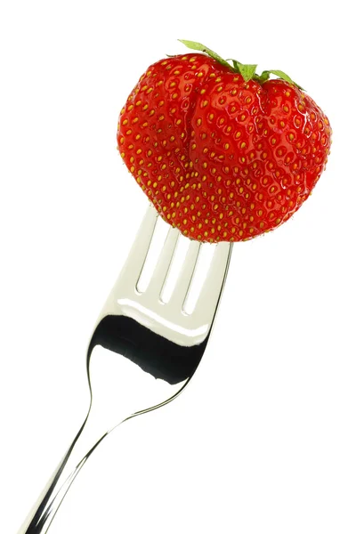 stock image One whole fresh strawberry on a shiny metal fork