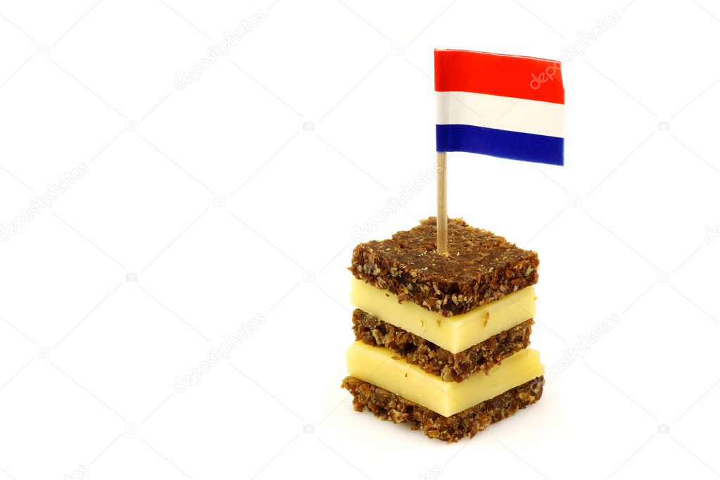 Layered rye bread and cheese snack with Dutch flag toothpick
