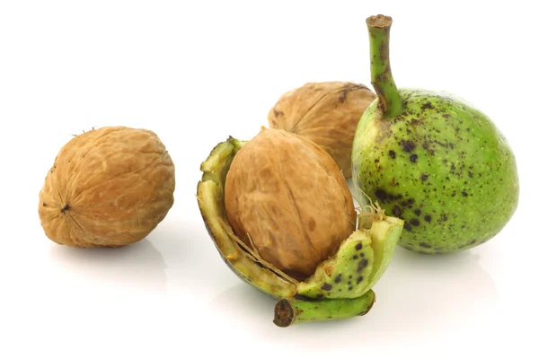 Fresh walnuts (Juglans regia) with shell opened — Stock Photo, Image