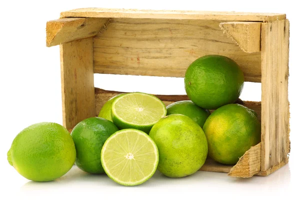 Fresh lime fruit in a wooden crate — Stock Photo, Image