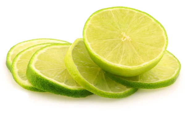 Fresh lime fruit and some thin slices — Stock Photo, Image