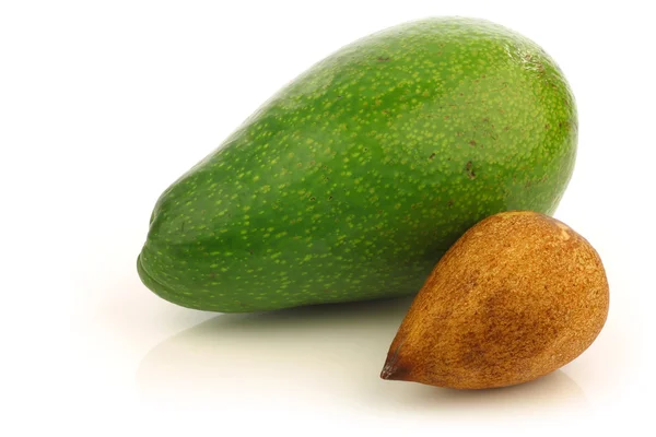 Fresh and ripe avocado and a seed — Stock Photo, Image
