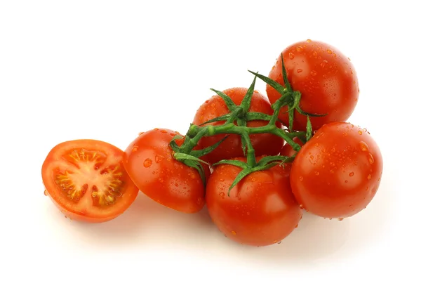 Tomates na videira e um corte — Fotografia de Stock