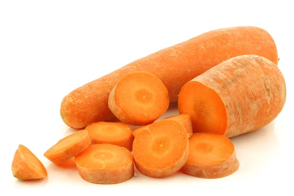 Fresh winter carrot and a cut one — Stock Photo, Image
