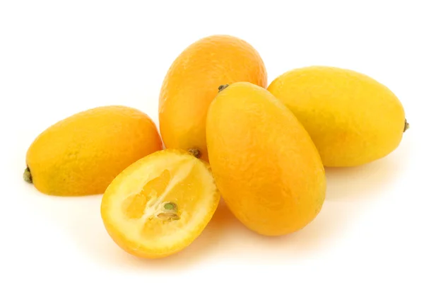 Kumquats(Citrus japonica) and a cut one — Stock Photo, Image