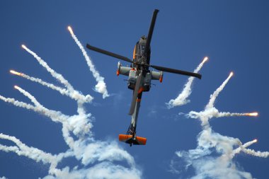 Apache AH-64D Solo Display Team shoots flares clipart