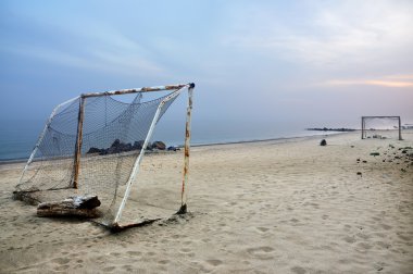 Football on a beach clipart