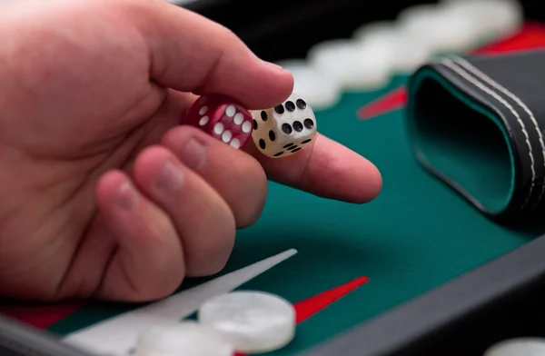 Backgammon - hand and dice — Stock Photo, Image
