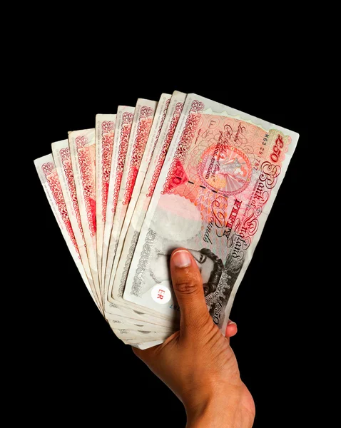 Χρήματα που κρατιούνται χέρι - Ηνωμένο Βασίλειο νόμισμα με διαδρομή αποκοπής - μαύρο bg — Φωτογραφία Αρχείου