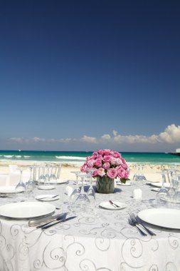 Table for wedding with bouquet of rose's clipart