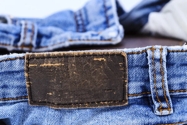 Tom läder etikett Visa jeans för din bra bandnamn — Stockfoto