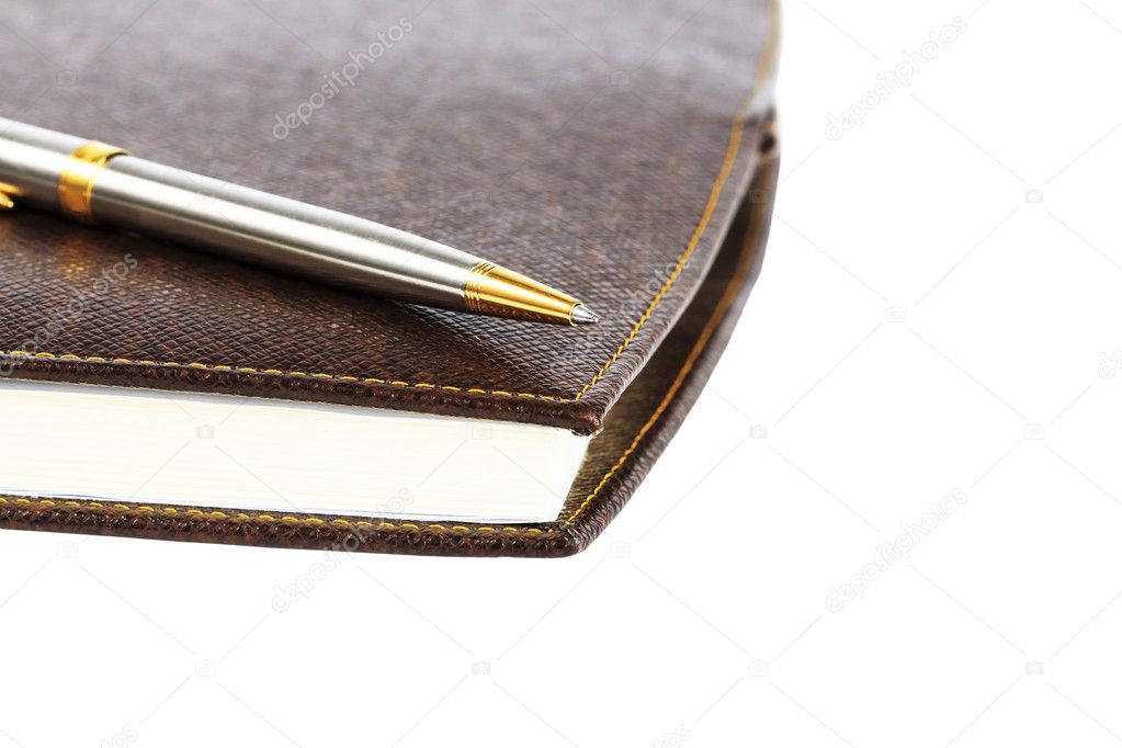 Brown red leather notebook with pen