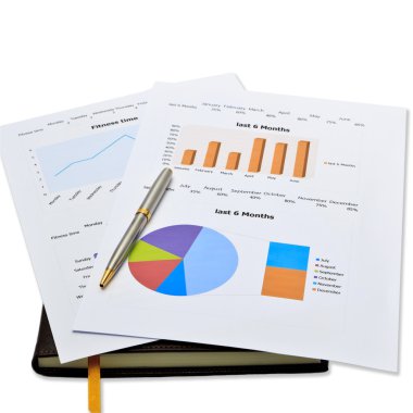 CloseUp of paper with charts at desk in the office. Before the m clipart