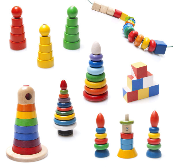 Very many colorful wooden pyramidions fnd beads toy on white background