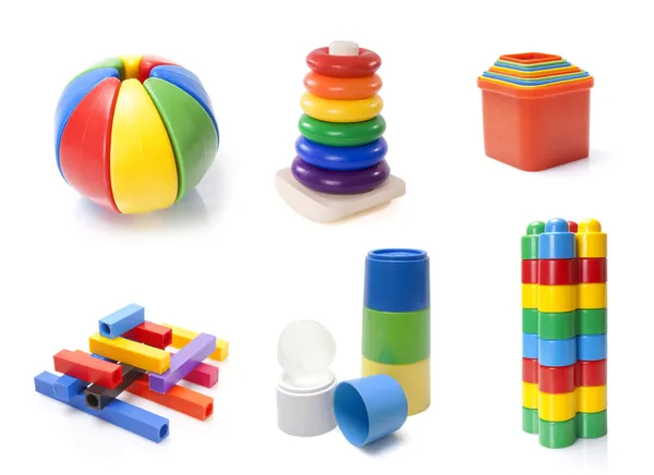 Muitos brinquedos coloridos para crianças no fundo branco — Fotografia de Stock