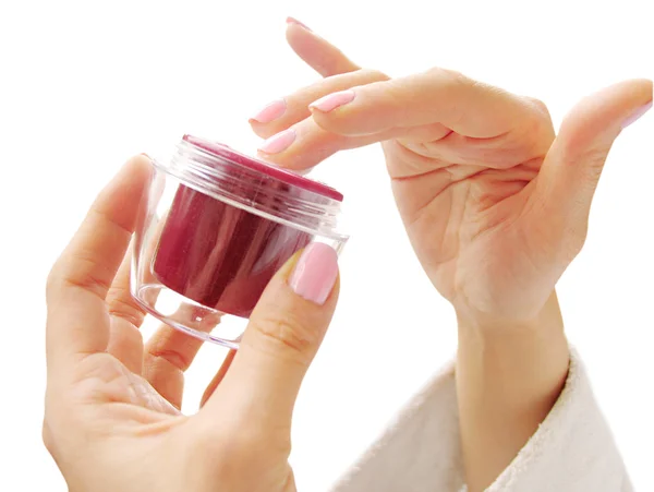 Female hands with a cosmetic cream — Stock Photo, Image
