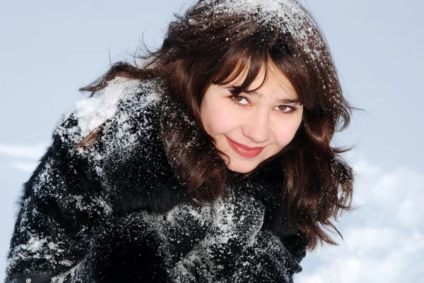 stock image Young beautiful woman with snow