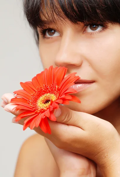 stock image Young beautiful woman with flower