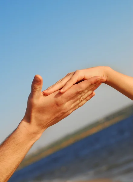 stock image Two hands on blue sky