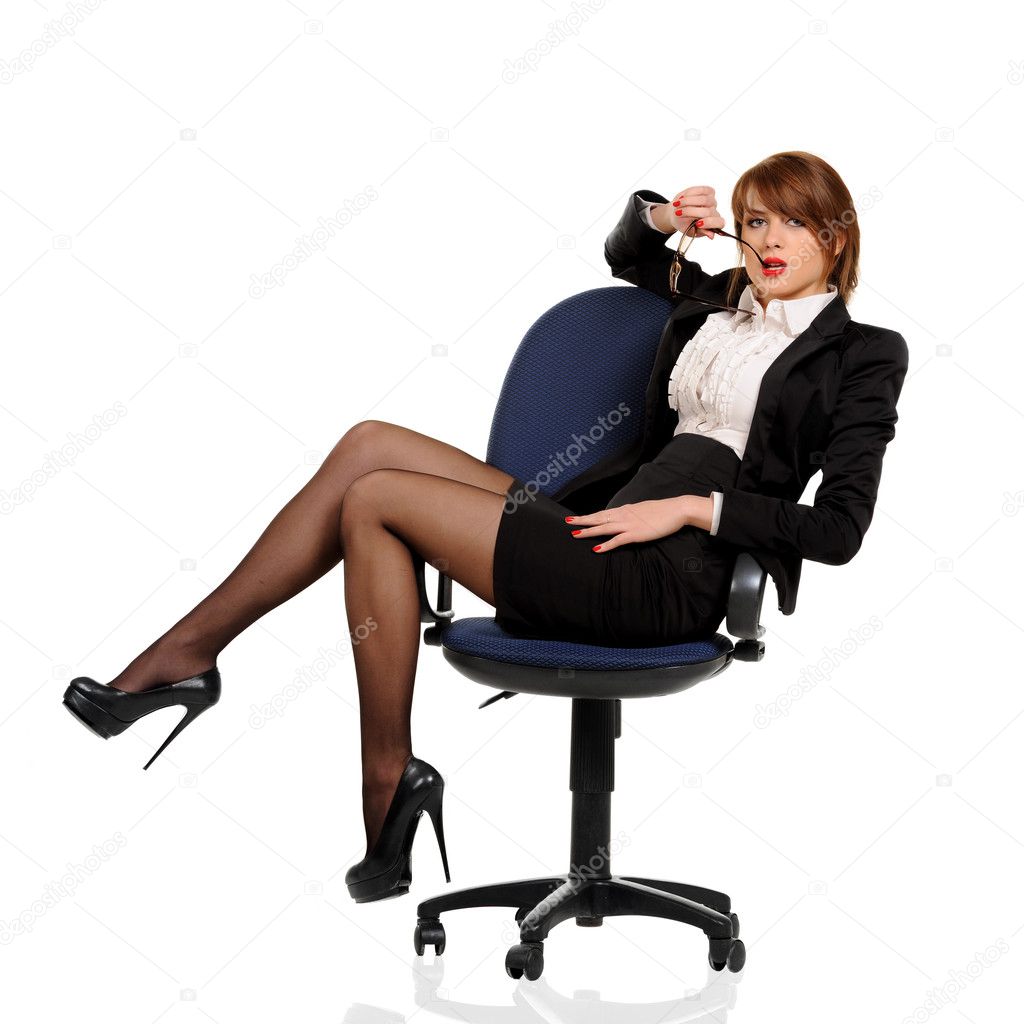 Young business woman sitting in office chair