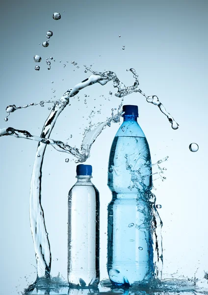 Bottles with mineral water and splash