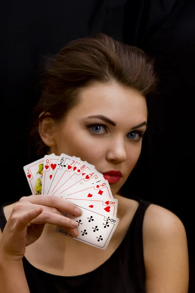 Damen med fan av spelkort Stockbild