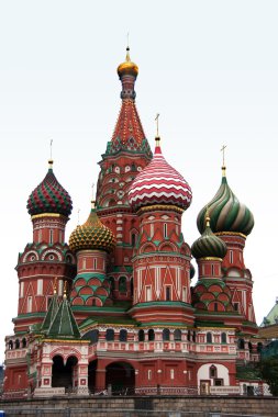 The towers of Saint Basil's Cathedral isolated against a light b clipart