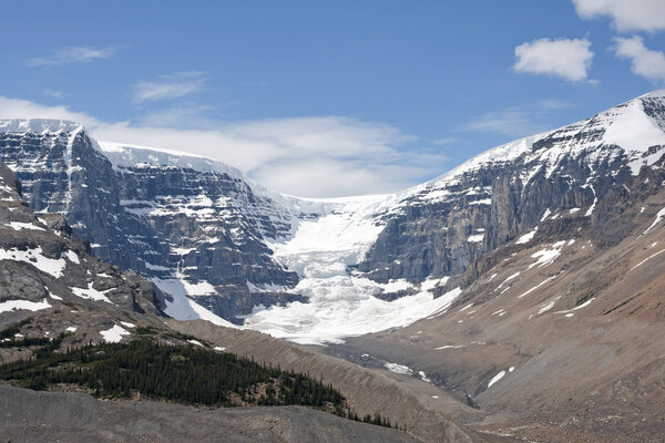 Columbia Glacier glides down off a wall of granite and snow in t