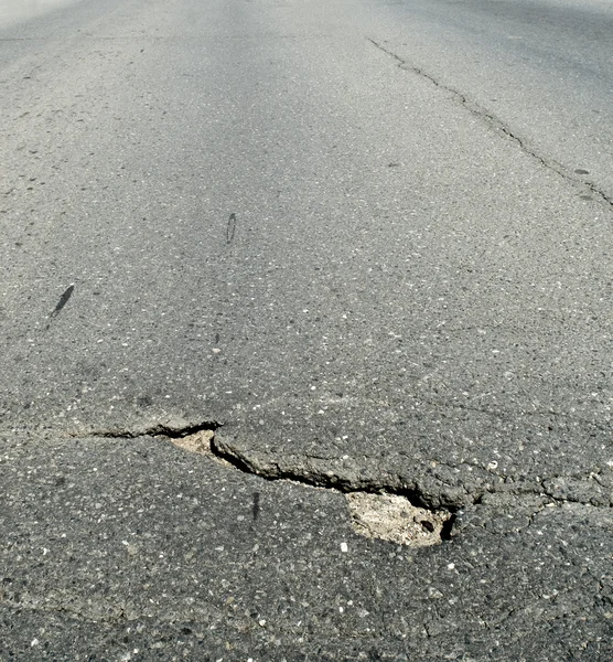 Skadad asfalt — Stockfoto
