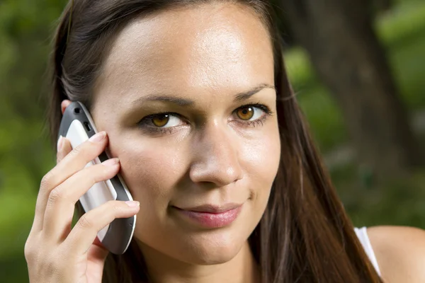 stock image Beautiful young girl talking on the phone