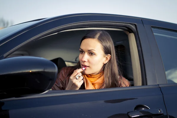 stock image Woman applying makeup