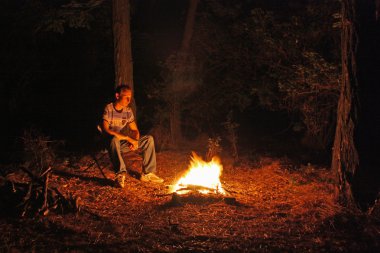 Man near the bonfire clipart