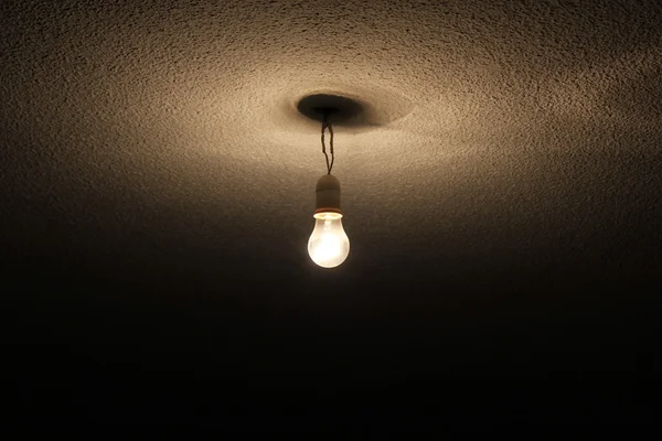 A wire bulb hung in the roof — Stock Photo, Image